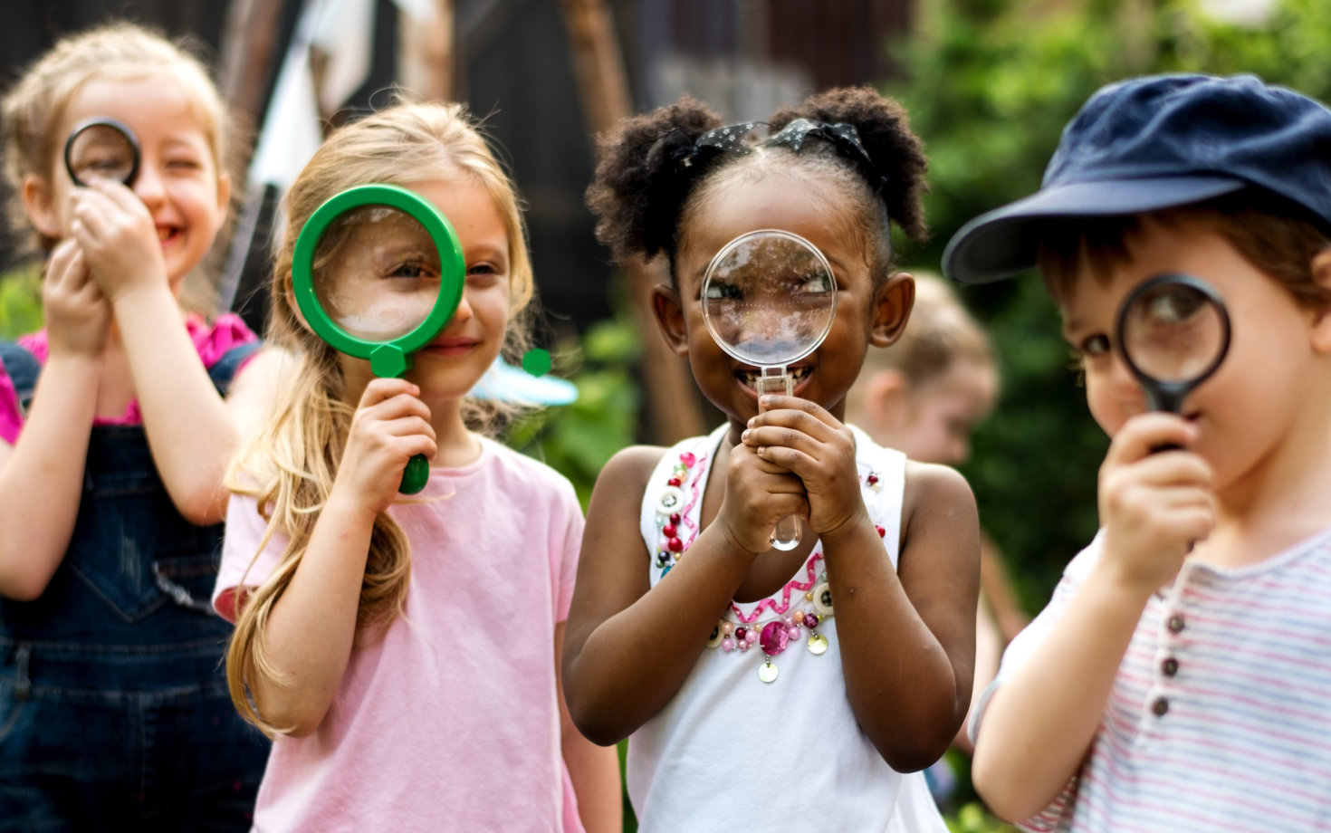 children with magnifying glasses